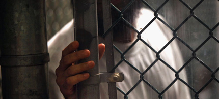 A detainee stands at a fence inside the detention center in September 2010 in Guantanamo Bay, Cuba. (photo: John Moore/Getty Images) A detainee stands at a fence inside the detention center in September 2010 in Guantanamo Bay, Cuba. (photo: John Moore/Getty Images)